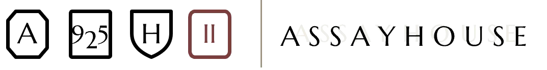 Volume Two's hallmark set: the three sitewide marks — A, 925, H — alongside the volume's own Roman numeral II mark in Oxblood, next to the Assayhouse wordmark
