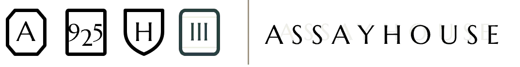 Volume Three's hallmark set: the three sitewide marks — A, 925, H — alongside the volume's own Roman numeral III mark in Slate, next to the Assayhouse wordmark