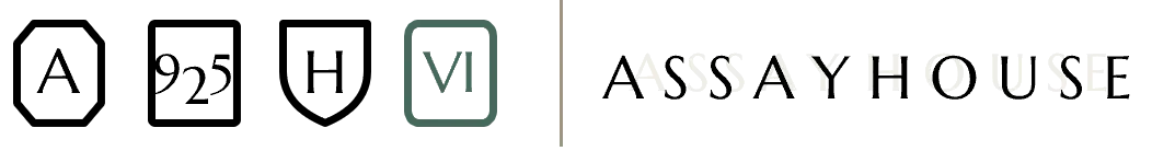 Volume Six's hallmark set: the three sitewide marks — A, 925, H — alongside the volume's own Roman numeral VI mark in Sea Green, next to the Assayhouse wordmark